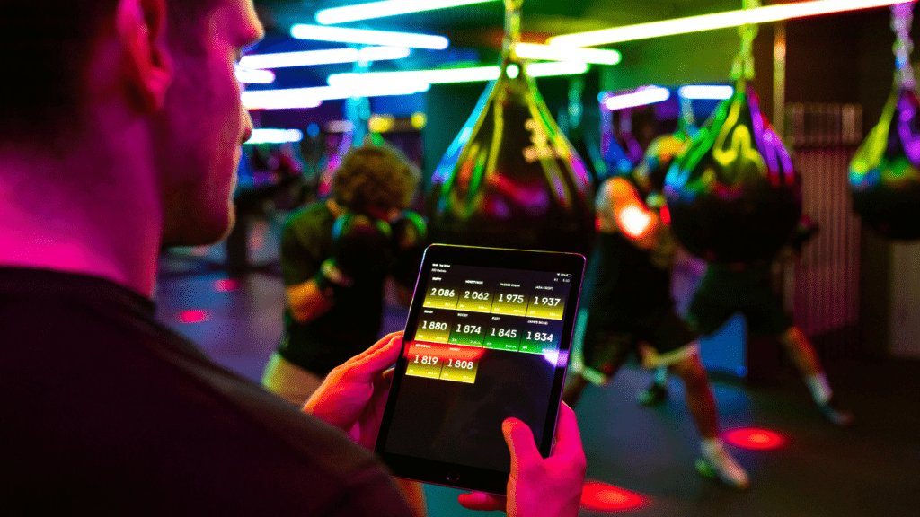 a person is using a tablet in a gym