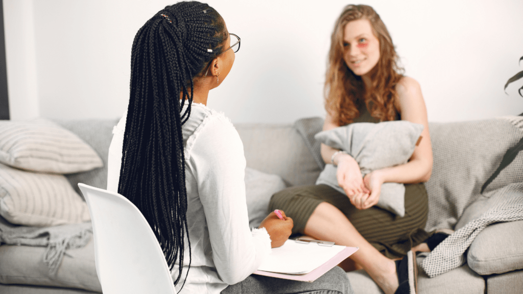 two people sitting on a couch