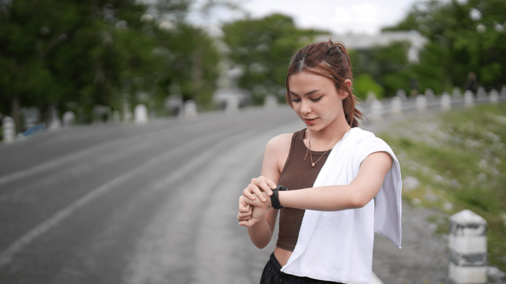 a person is looking at their watch while standing on the road