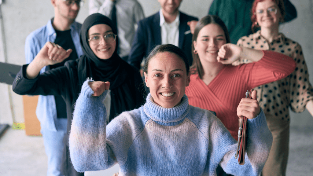 a group of people raising their arms in the air