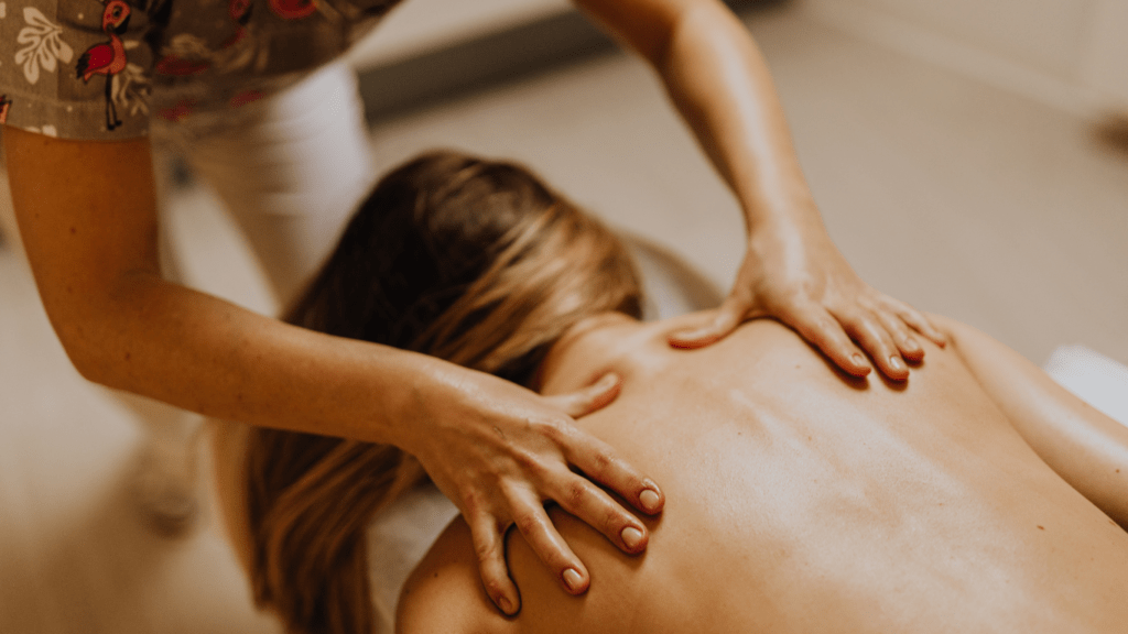 a person getting a back massage at a spa