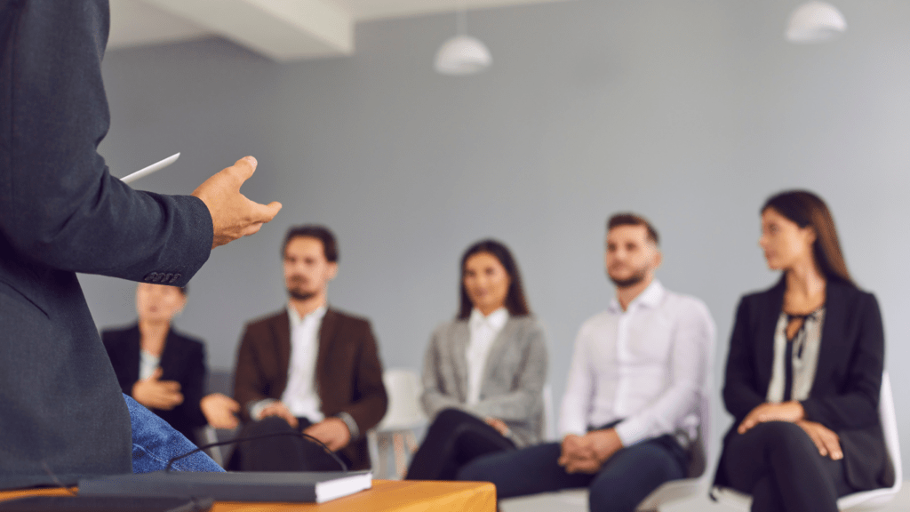 a person giving a presentation to a group of people