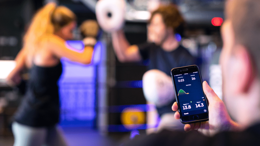 a person is using a tablet in a gym