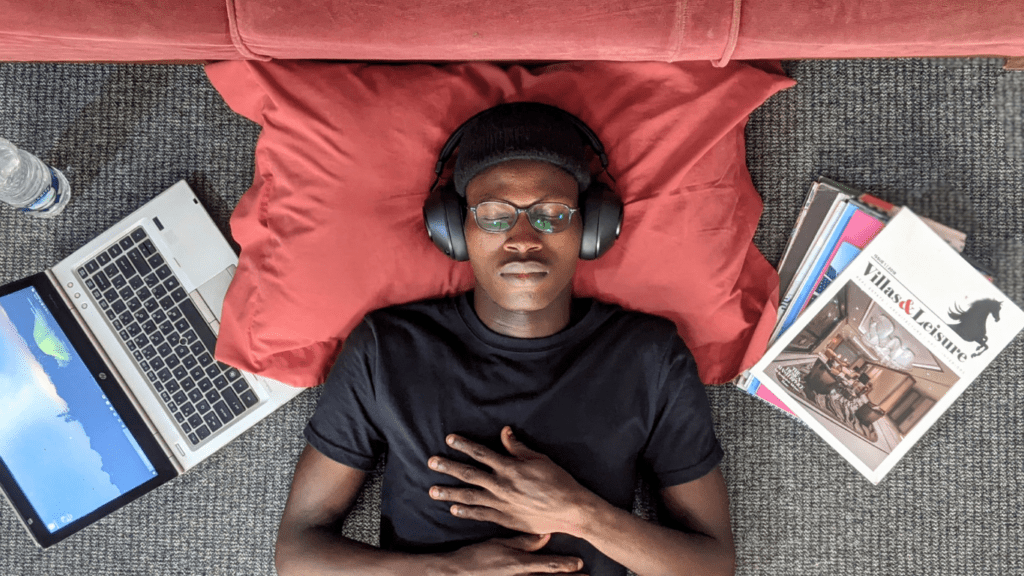 a person sleeping in front of a laptop