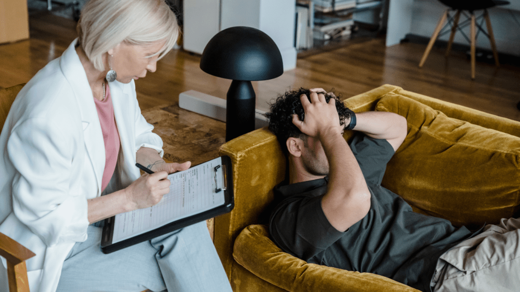 two people sitting on a couch