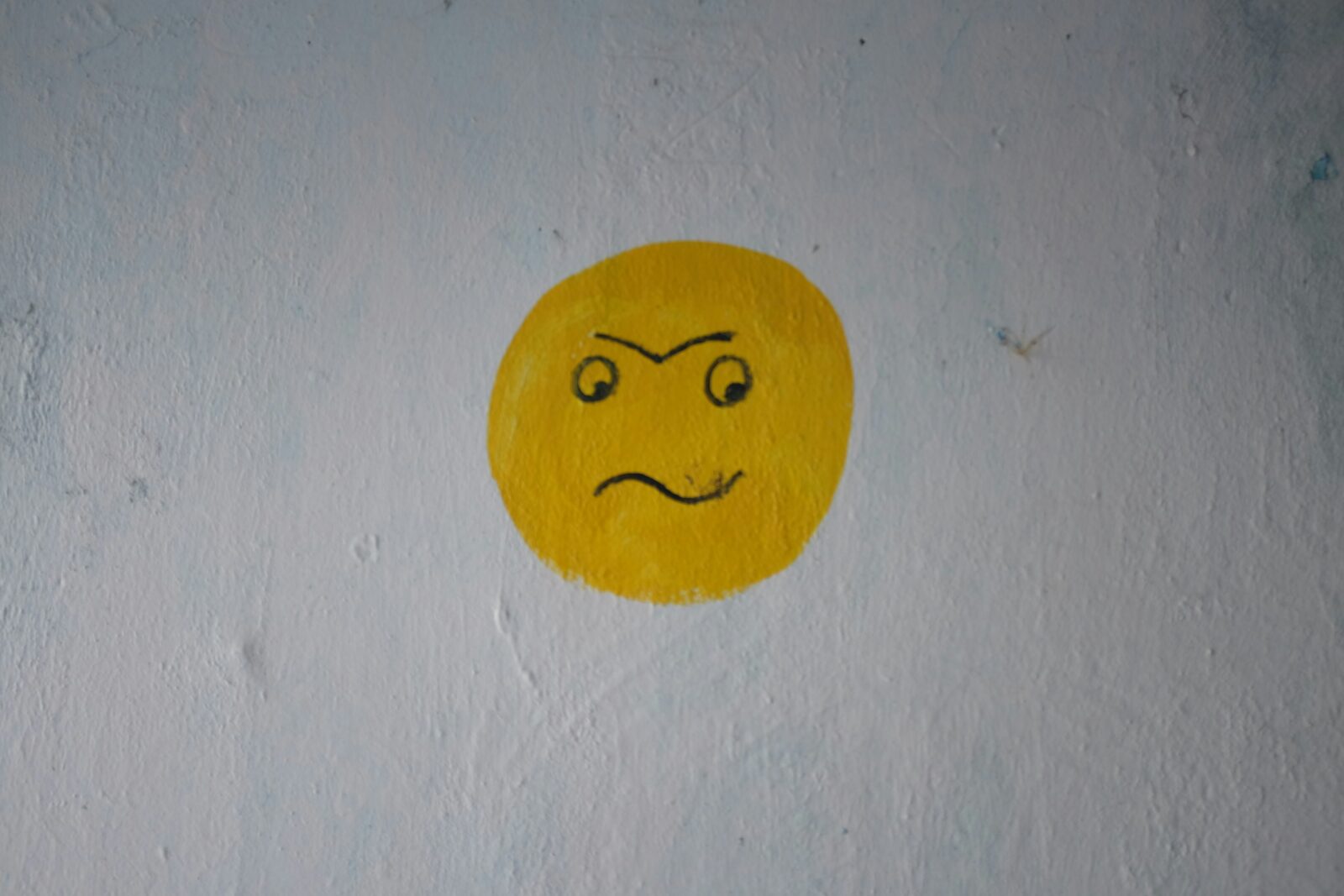 A smiley painted on a wall.